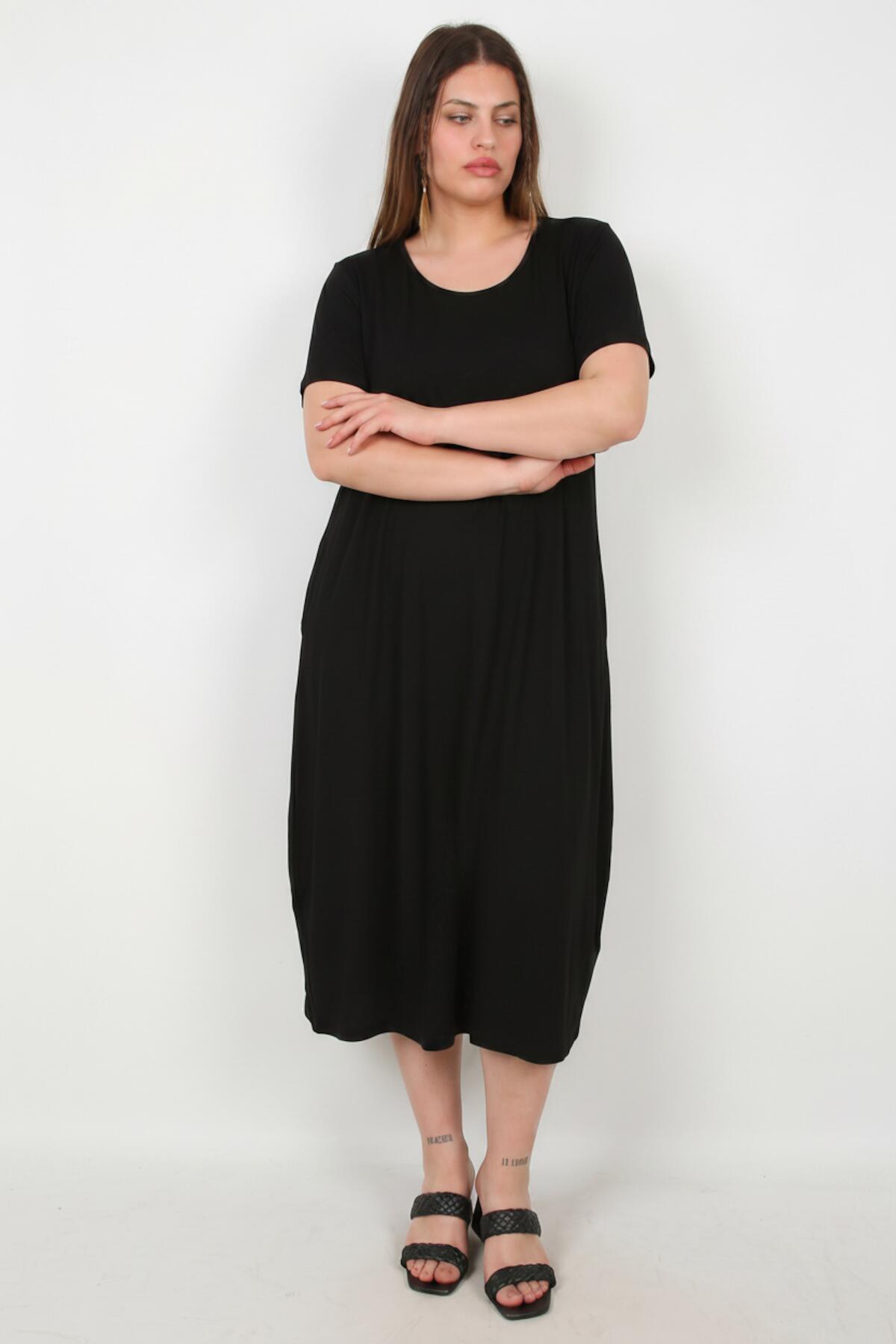 Oversized-Kleid mit Seitentaschen — Schwarz