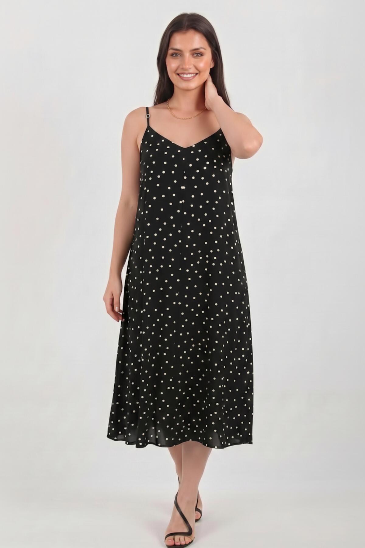Gepunktetes Kleid mit Bindeträgern — Schwarz