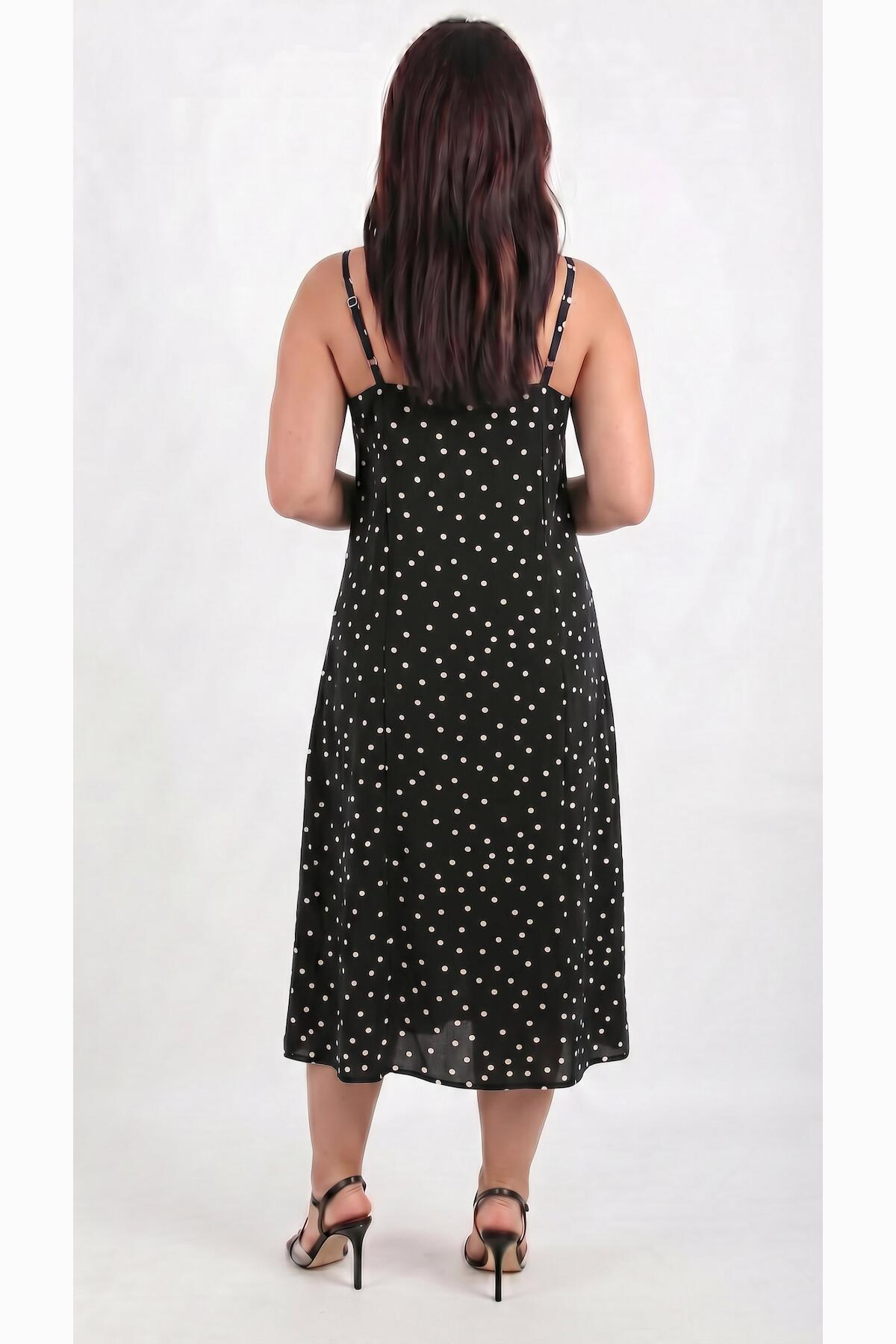 Gepunktetes Kleid mit Bindeträgern — Schwarz
