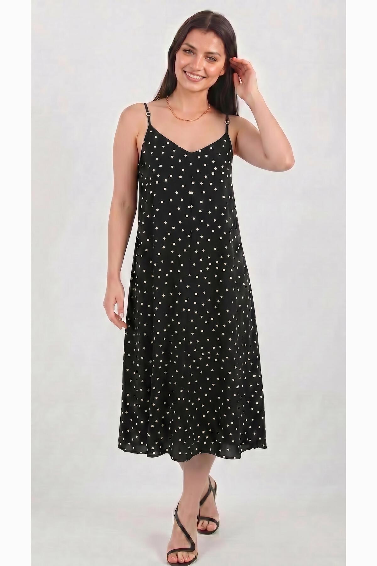 Gepunktetes Kleid mit Bindeträgern — Schwarz