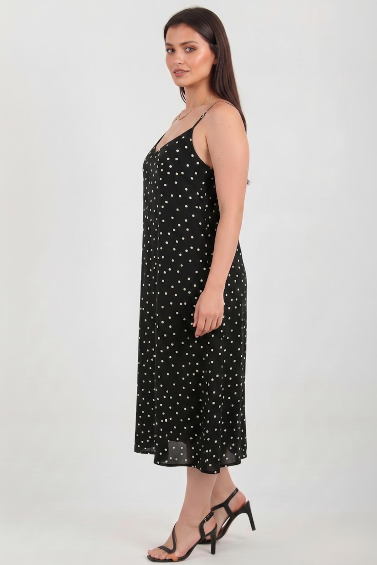 Gepunktetes Kleid mit Bindeträgern — Schwarz