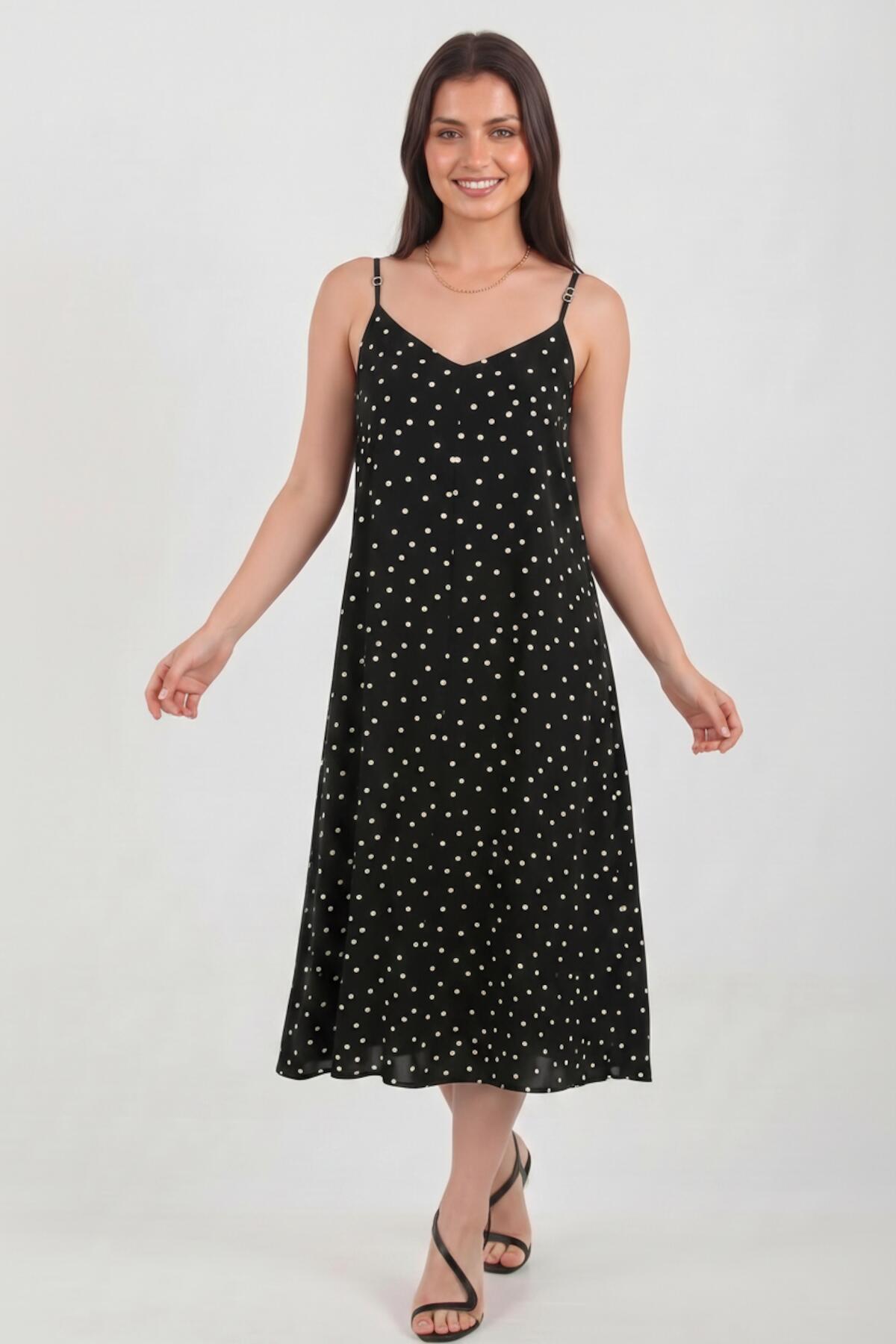 Gepunktetes Kleid mit Bindeträgern — Schwarz